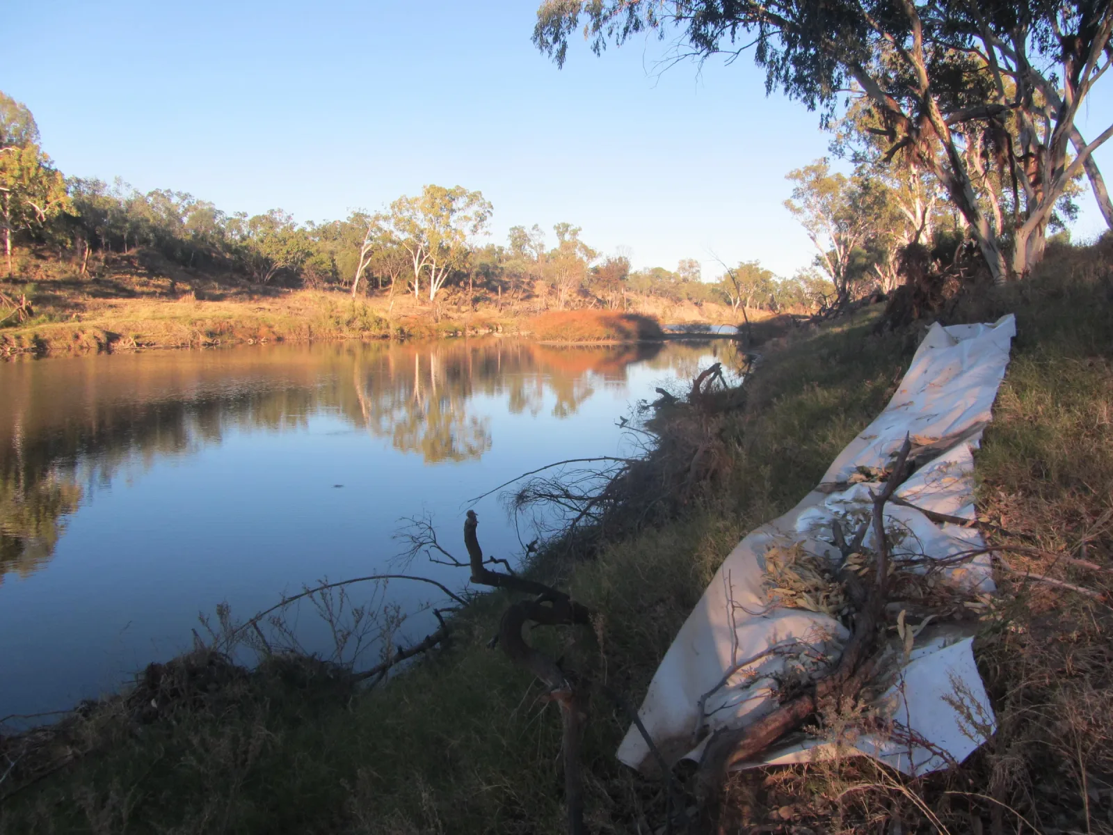 The paper dries on the riverbank